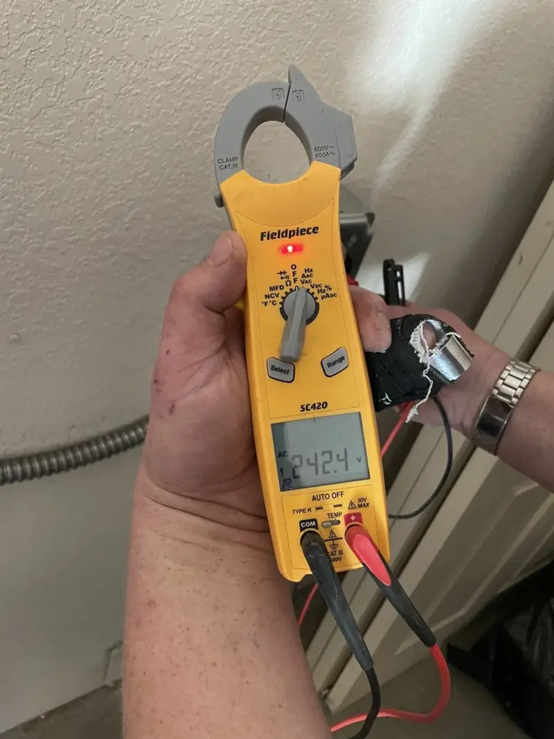 Voltage testing with clamp meter during Ceiling Fan Installation in Marlborough